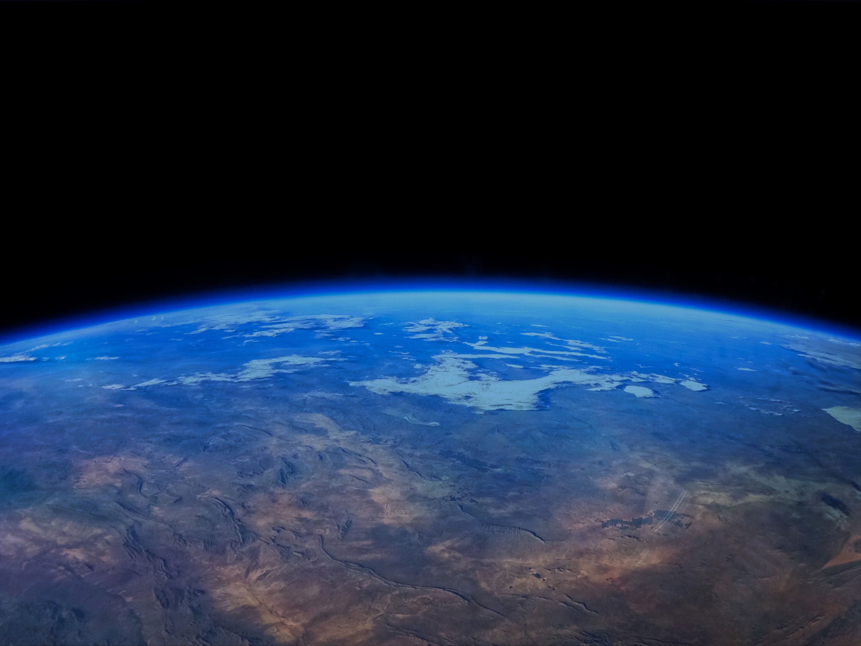 A view of Earth from space with black sky above