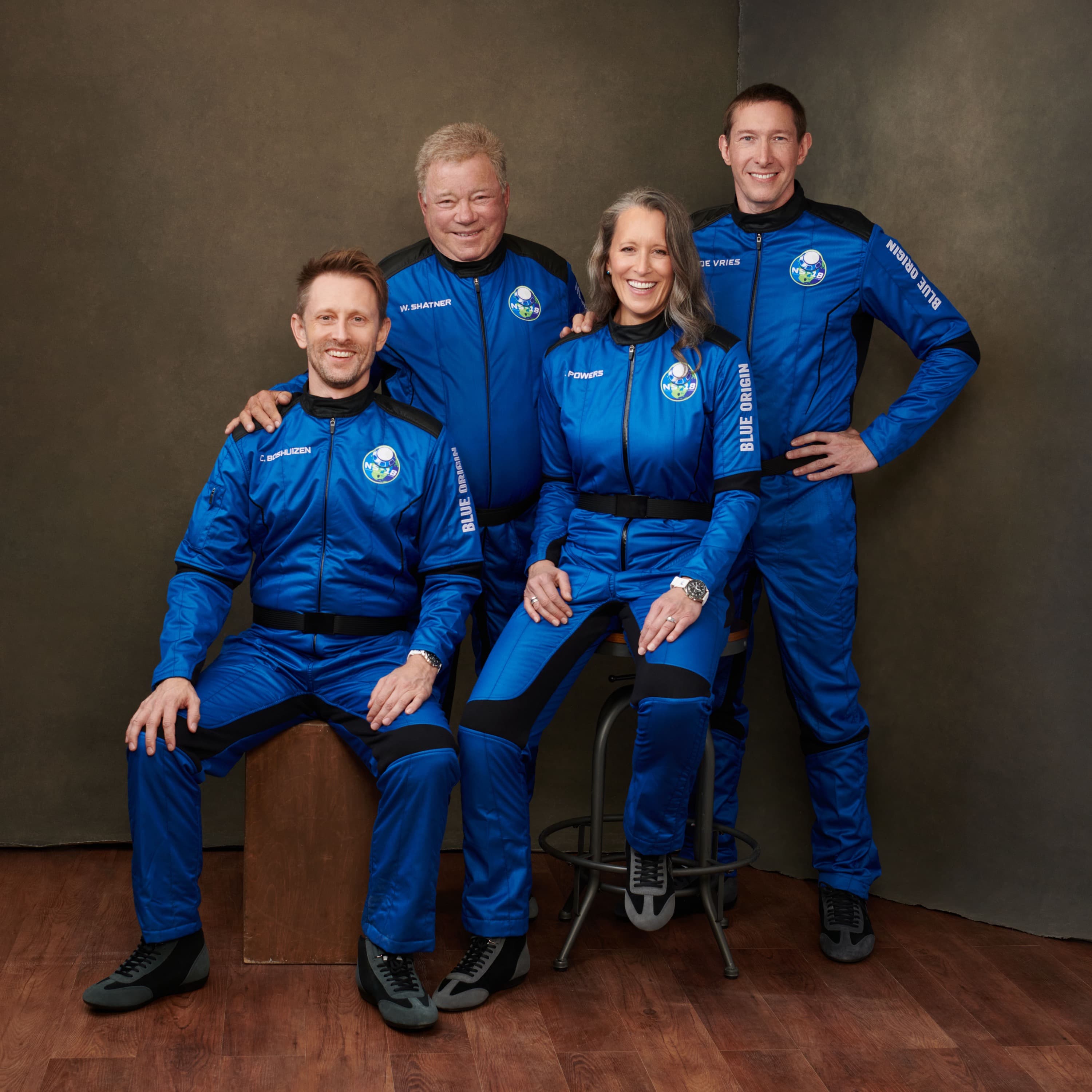 Crew members pose for their official portrait. William and Glen are standing behind Chris and Audrey, who are seated.
